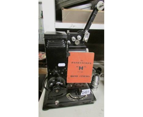 A vintage Pathescope "H" 9.5 mm home cinema projector.