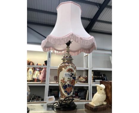 An oriental floral decorated urn table lamp