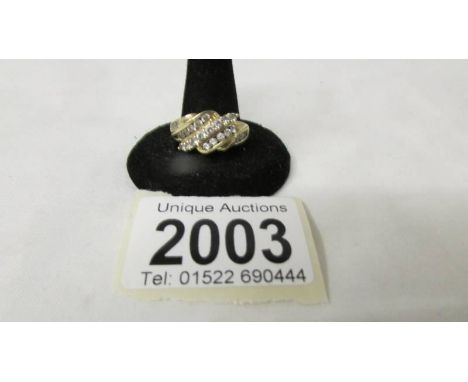 A stone set ring marked 585, size R half, 3.7 grams.