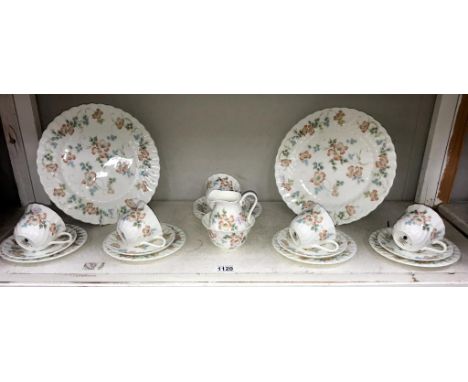 A Wedgwood cottage rose porcelain tea set ( 5 cups, 5 saucers, 6 plates, 1 milk jug &amp; 1 sugar pot)