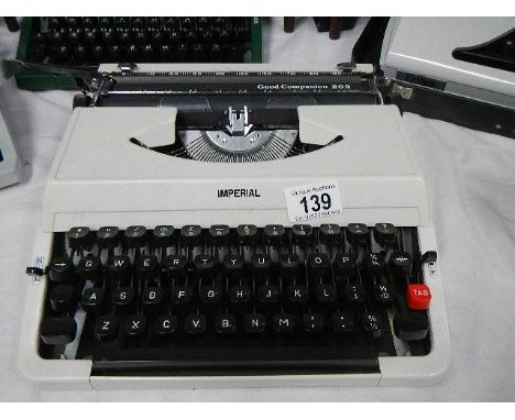 An Imperial Good Companion 203 portable typewriter in cream.