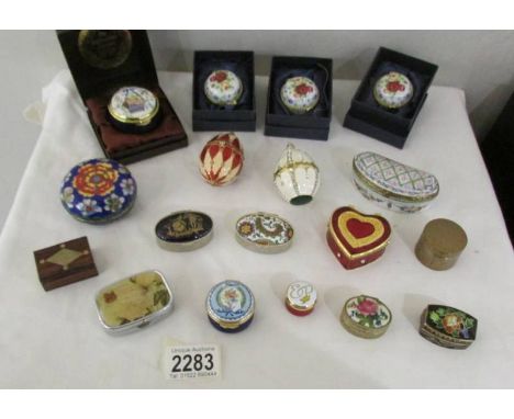 A collection of 18 enamel and other pill boxes.