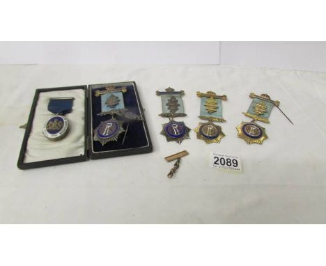 A Masonic silver locket and 4 RAOB silver medals (Roll of Honour). ****Condition report**** The locket is silver,  hallmarked