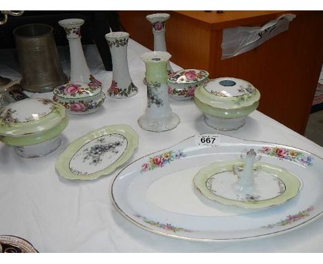 A mixed lot of china trinket set items including candlesticks.