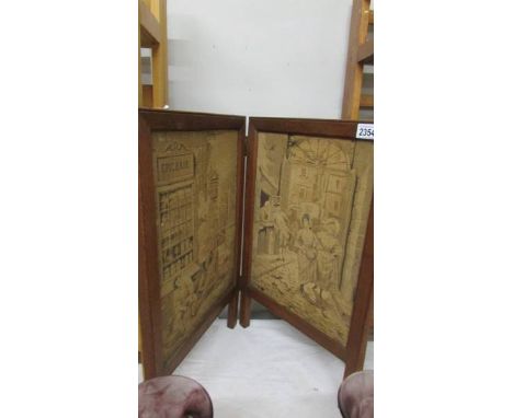 A Bi-fold tapestry fire screen.