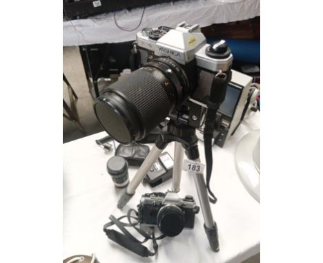 A Yashica SLR with telephoto lens on tripod, an Olympus CM0, and extra lens , bags, slide viewer ****Condition report**** Oly