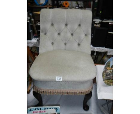 A button back bedroom chair.
