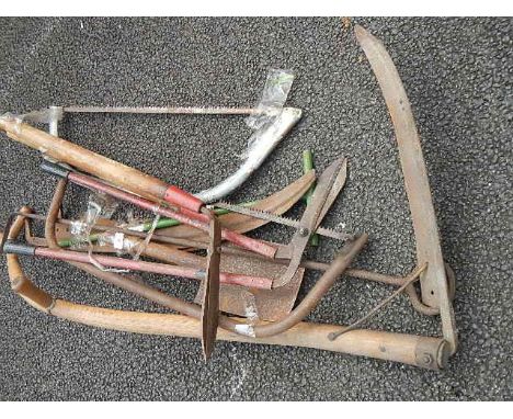 A quantity of assorted garden tools.