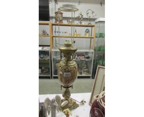 A heavy brass and marble table lamp base.