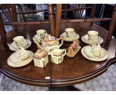 A cottage ware tea set, 23 pieces, teapot has chip to spout