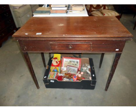 A Victorian mahogany fold over card table with tapered legs and drawer Height 75cm, width 91cm, depth closed 45cm