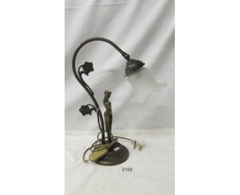 A figural swan neck table lamp with glass shade.