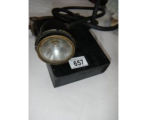 A battery operated miner's lamp.