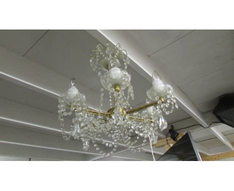 A 6 lamp glass chandelier.
