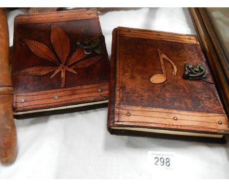 Two leather bound sketch books.
