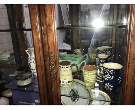 A quantity  of pottery including loving cup, candlestick, beaker etc