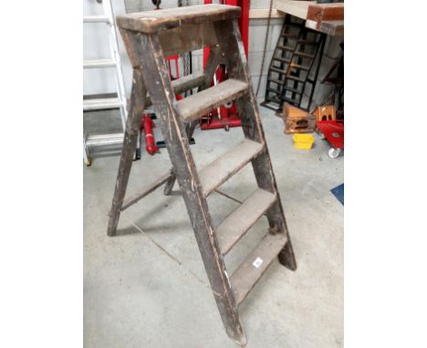 A five step wooden step ladder.