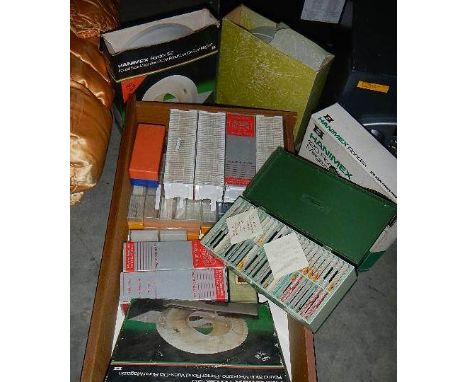 A vintage projector together with a large quantity of mid 20th century slides etc.,