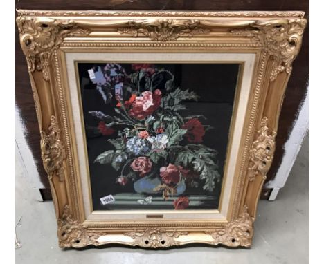 A gilt framed wool work tapestry of flowers by Phillipa Eminson 1987 (58cm x 67cm)