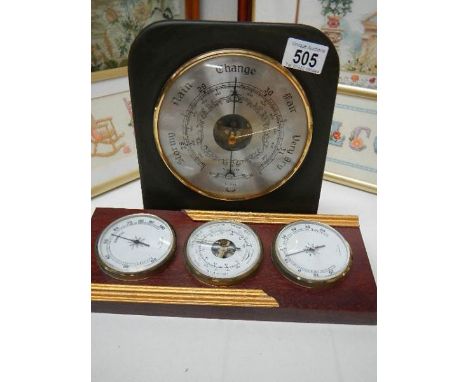 A slate barometer and another barometer.