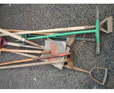 A quantity of assorted garden tools.