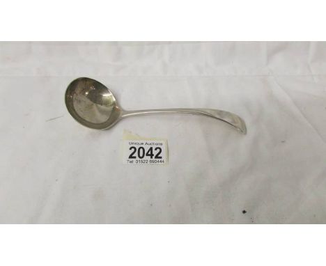 A hall marked silver ladle.