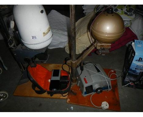 2 photograph enlargers and a projector.