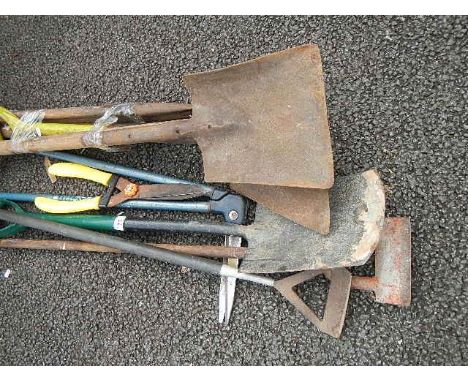 A quantity of assorted garden tools.