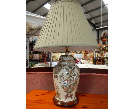 An oriental style ceramic table lamp complete with shade.