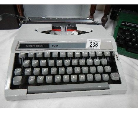 A Silver Reed 100 portable typewriter in grey.