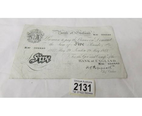 A Bank of England white £5 note dated 29 May 1947, No. M30 006840, K O Peppiatt, ****Condition report**** Small fold to 2 cor