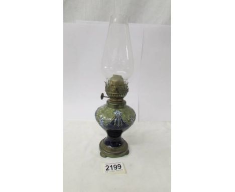 A small Royal Doulton oil lamp with chimney, 17 cm to top of burner, 27 cm to top of chimney.