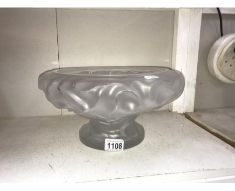 A large glass bowl marked Lalique France