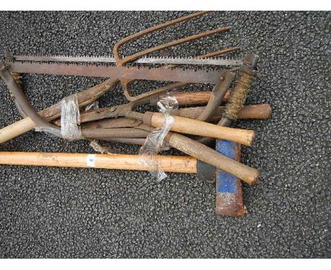 A quantity of assorted garden tools.