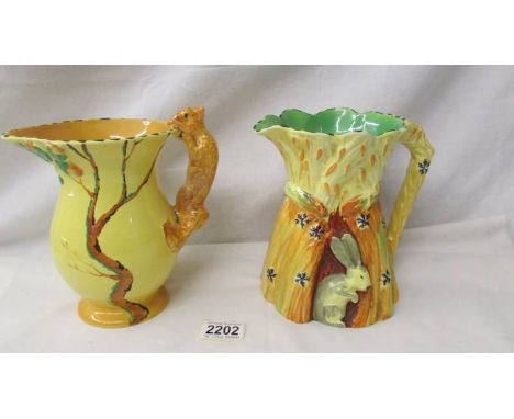 Two Burleigh pottery jugs - one with squirrel handle and the other decorated with a rabbit.