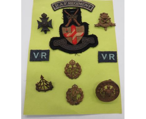 Selection of various Army and RAF badgesManchester Regiment helmet plate centre, Reconnaissance brass cap badge, Bucks Battal