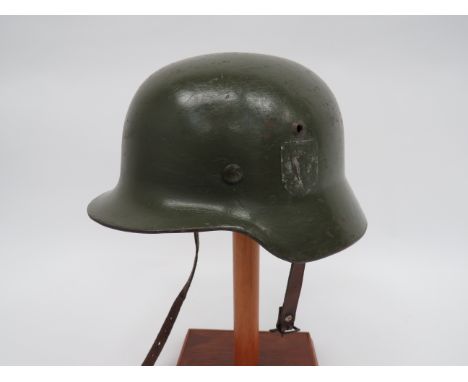 German M1940 Rolled Edge Steel Helmetgreen repainted crown. Lower rolled edge. Leather, eight tongue liner on a zinc securing