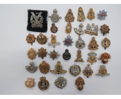 Selection of Various Cap Badgesincluding white metal Tyneside Scottish ... KC bronzed ADC ... KC brass Royal Fusiliers ... KC