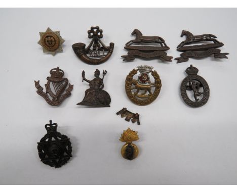 Selection of Officer Cap Badgesincluding 2 x bronzed West Yorkshire (blades) ... KC bronzed Connaught Rangers (lugs) ... Bron