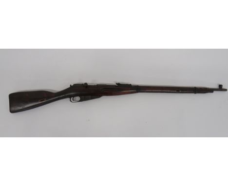 Deactivated Russian M1891 Rifle28 1/2 inch, 7.62 mm, blued barrel.  Front hood sight and rear ladder sight.  Breech with Russ