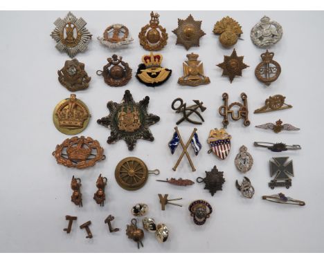 Selection of Various Badgescap badges include QC gilt RAF Officer’s beret ... Brass RMLI ... QC brass RM ... Brass Coldstream