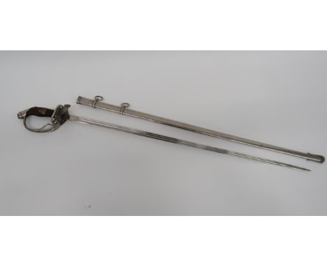 Imperial German Officer’s Sword31 inch, single edged blade with two narrow fullers.  The forte with “W.K &amp; C” trade mark.