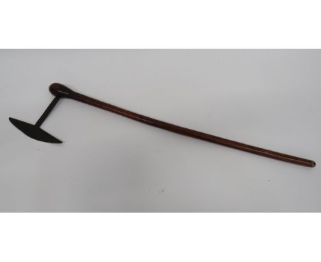 Late 19th Century Zulu Axesingle ended, crescent blade with long shaft.  Polished bulbous ended handle.  The lower handle wit