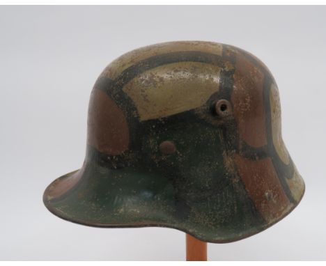 Imperial German Camouflaged Steel Helmetmodel 1916, grey green painted helmet of typical form. Field painted with extra green