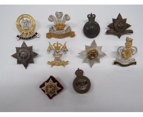 Small Selection of Cavalry Officer Cap Badgesconsisting silvered 4th Royal Irish Dragoons by “J &amp; Co” ... Silvered and gi