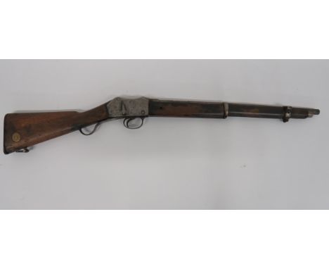 Martini Henry MKII Carbine.577, 20 3/4 inch, drill purpose barrel cut through breech.  Ladder sight absent.  Flat side body w