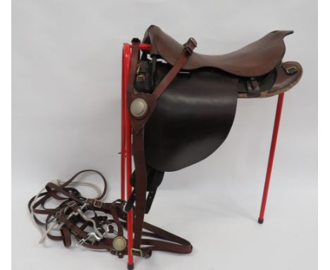 1912 Pattern Cavalry/Yeomanry Saddle and Reinsdark brown leather saddle and side flaps.  Steel front and rear arches.   Woode