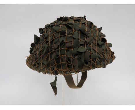 1945 Dated MKIII Turtle Pattern Steel Helmetgreen, rough texture crown with sandbag and netting cover.  Black treated linen l