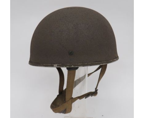 WW2 1944 Dated Airborne Parachute Steel Helmetdark brown, rough texture, outer shell. Rubber padding liner with brown leather