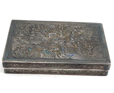Antique chinese repousse silver box measures approx 12.8cm by 7.6cm 2.3cm deep the box show some enamel detail but has mainly